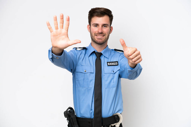 Young police caucasian man isolated on white background counting six with fingers - Fotografie, Obrázek