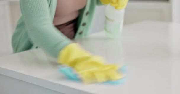 Spray, cleaning or hands of woman at kitchen counter for housekeeping, disinfection or safety of dust, bacteria or dirt. Closeup, detergent or liquid bottle for cloth to wipe countertop table at home. - Footage, Video