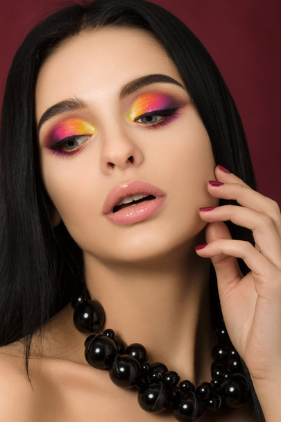 Beauty portrait of woman with colourful eye makeup - Photo, Image