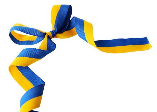 Colorful blue-yellow fabric ribbon with bow isolated on white - Foto, afbeelding