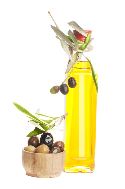Olive oil bottle and branch isolated - Photo, image