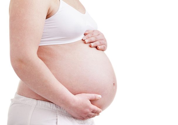 Close up of a pregnant belly - Фото, изображение