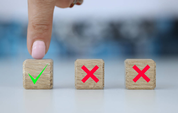 Hand chooses between two dice with Yes and No. Making right decision concept - Photo, Image