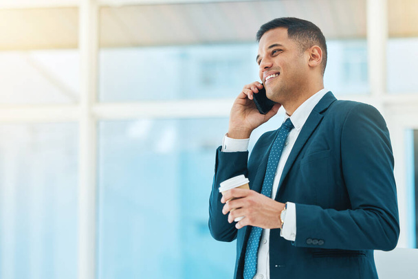 Phone call, talking and business man in office for online chat, networking and discussion. Corporate worker, coffee break and happy person on smartphone speak for planning, schedule and communication. - Photo, Image