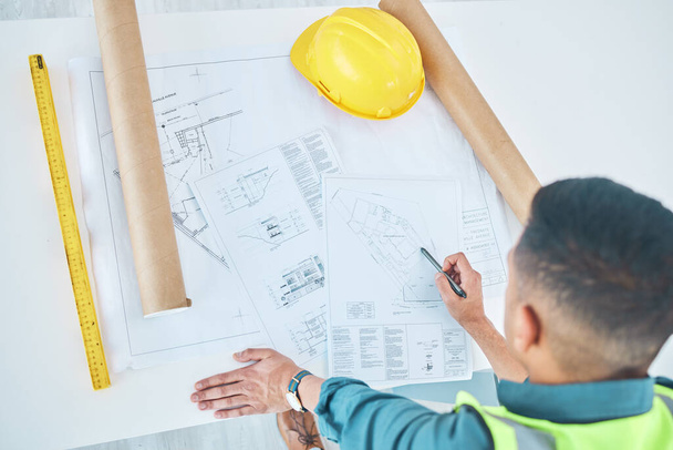 Blueprint, top view architect and planning man, engineer or developer reading floor plan of property design. Architecture, contractor inspection or engineering analysis of infrastructure illustration. - Φωτογραφία, εικόνα