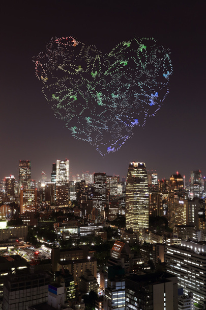 heart sparkle Fireworks celebrating over Tokyo cityscape at nigh - Photo, Image