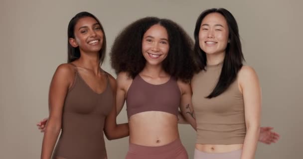 Diversity, underwear and portrait of women friends in studio for beauty, inclusion or wellness. Happy people hug on neutral background as different body care, skin glow or natural cosmetic comparison. - Footage, Video