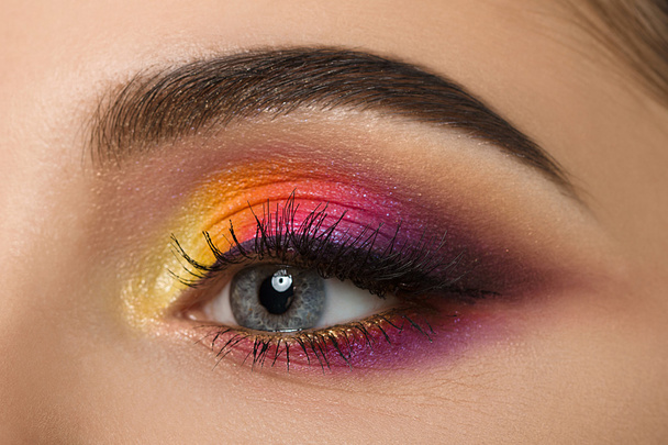 Close-up of woman eye with beautiful colourful makeup - Foto, imagen