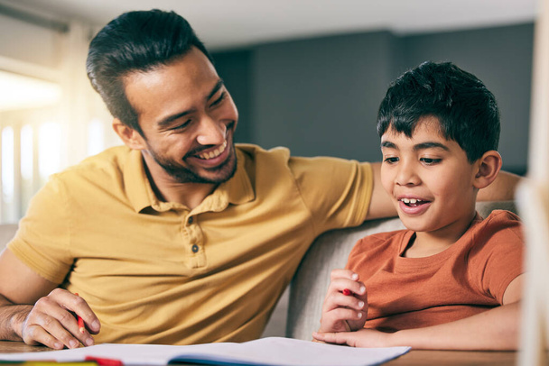 Help, father and boy with homework, notebook and conversation with education, learning and knowledge. Family, dad and kid writing, support and studying with child development, advice and speaking. - Photo, Image