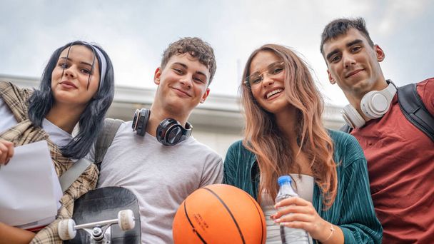 group of teenage students gen z in front of school university male and female friends caucasian man and woman teenagers in front of campus or wait for the class back to school concept - Photo, Image