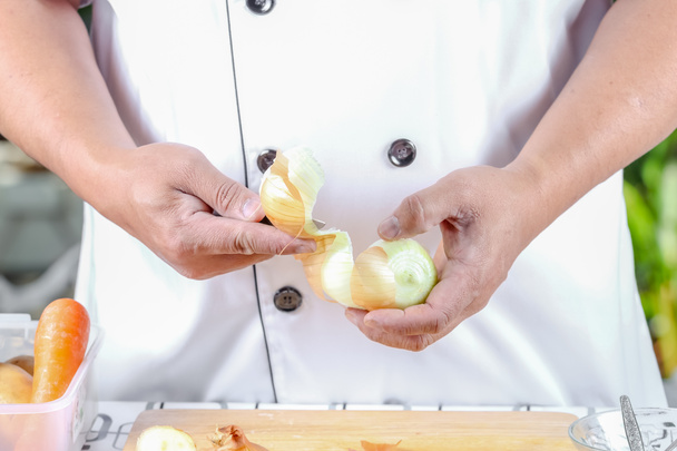 Chef peeling onions - Photo, Image