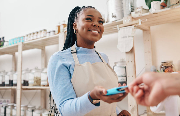 Sustainable shop, woman cashier and credit card with store and electronic transaction with small business. Worker smile, entrepreneur and happy African person with retail employee and shopping pay. - Фото, зображення