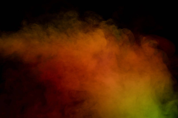 Orange and red steam on a black background. Copy space. - Photo, Image