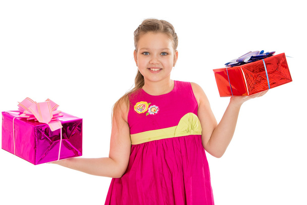 beautiful caucasian girl holding a beautifully packaged gifts - Photo, image