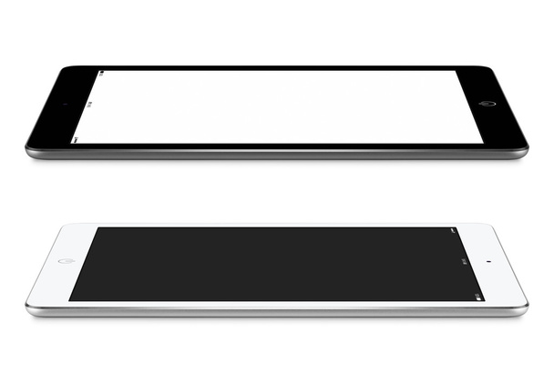 Вид с левой и правой стороны черно-белого планшета с пустым
 - Фото, изображение