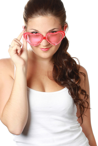 Young girl is holding red sunglasses - Valokuva, kuva