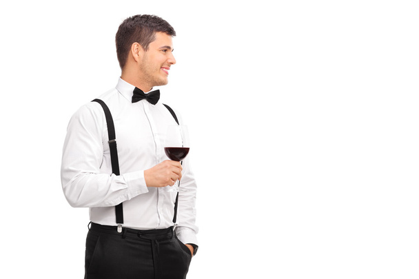 Man holding glass of wine - Фото, изображение