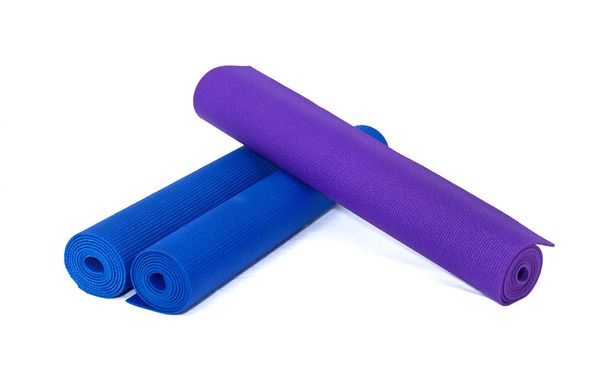 Three rolled exercise yoga mats on white - Photo, Image