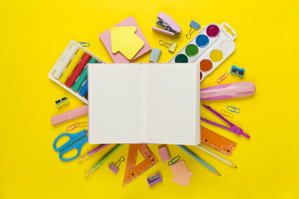 Various school stationery with notebook on color background, top view - Photo, Image
