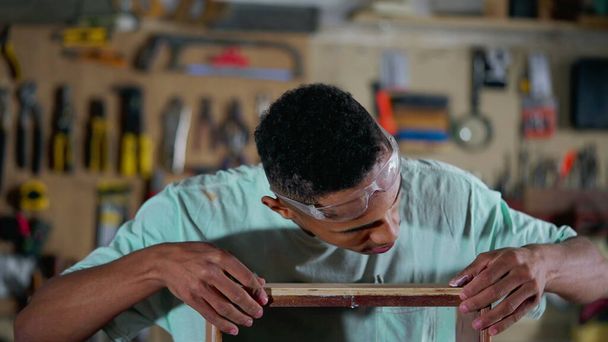 Young Black Apprentice at Furniture Building Workshop, Craftsmanship Occupation, A Brazilian worker at carpentry store - Fotoğraf, Görsel