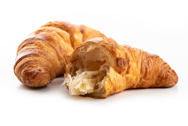 Croissanty. polámané a celé croissanty - Fotografie, Obrázek