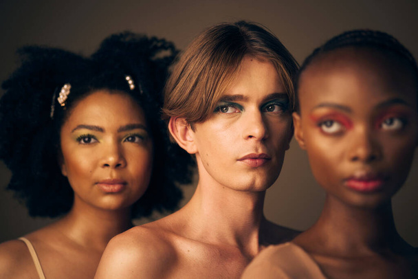 Glow, diversity and people with makeup, skincare and dermatology on a dark studio background. Group, man and women with cosmetics, multiracial and lgbtq with inclusion, shine or beauty with self care. - Foto, Bild
