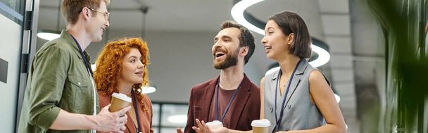 bearded businessman laughing near coworkers with takeaway drinks, coffee break in office, banner - Photo, Image