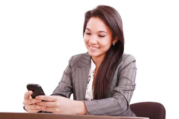 Красива азіатська бізнес жінка використовує мобільний телефон
 - Фото, зображення