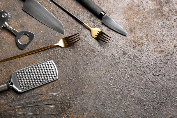 Different kitchen utensils on brown background - Photo, Image
