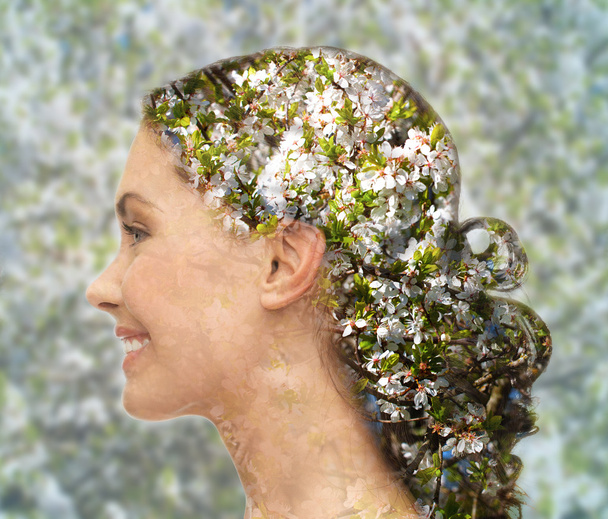 happy woman face over blooming tree pattern - Photo, image