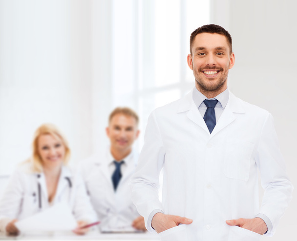 smiling male doctor in white coat - Photo, image