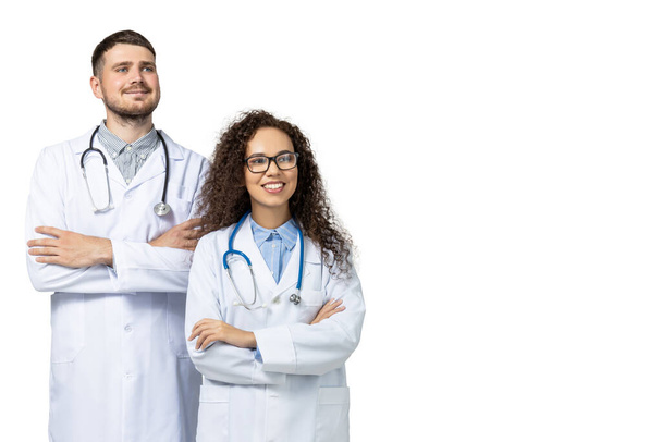 Male and female doctors in white uniform, isolated on white background - Photo, Image