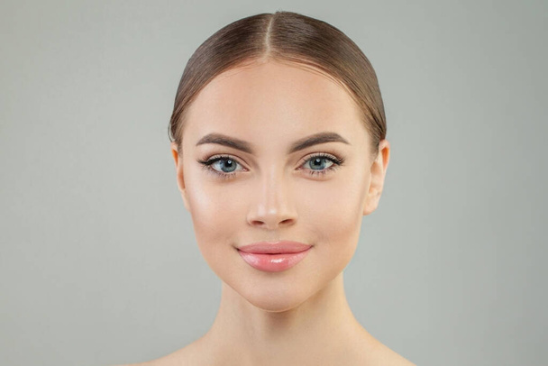 Female beauty. Pretty young woman with healthy fresh skin. Facial treatment, face lifting and skin care concept - Photo, Image