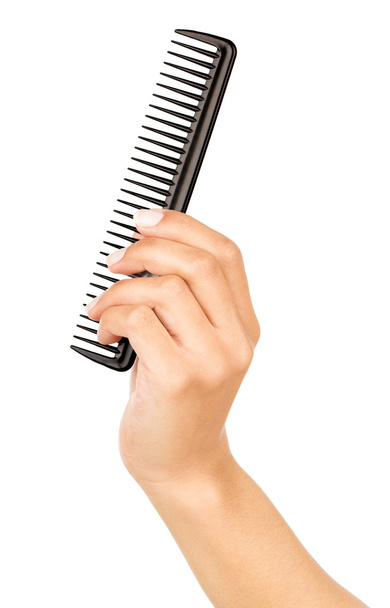 Hairbrush in the hand isolated on white - Valokuva, kuva