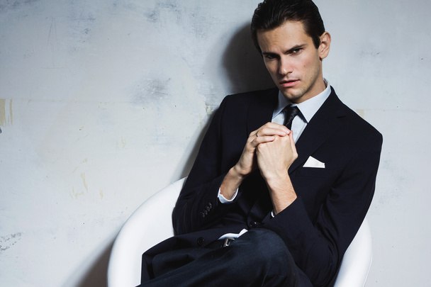 Handsome serious man in business suit. - 写真・画像