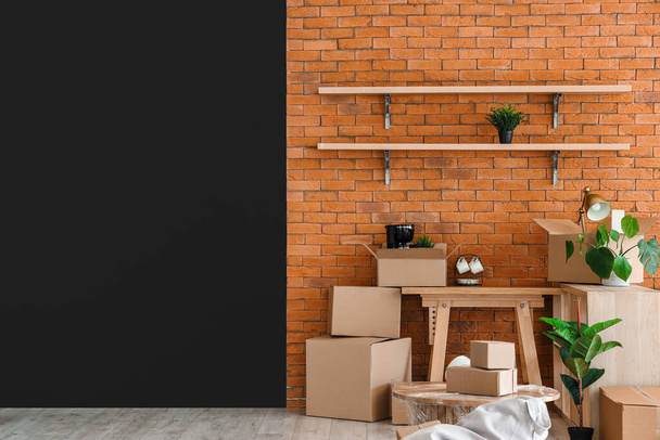 Interior of stylish office with cardboard boxes on moving day - Photo, Image