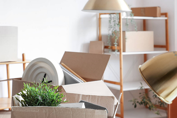 Cardboard boxes with things in office on moving day, closeup - Photo, Image