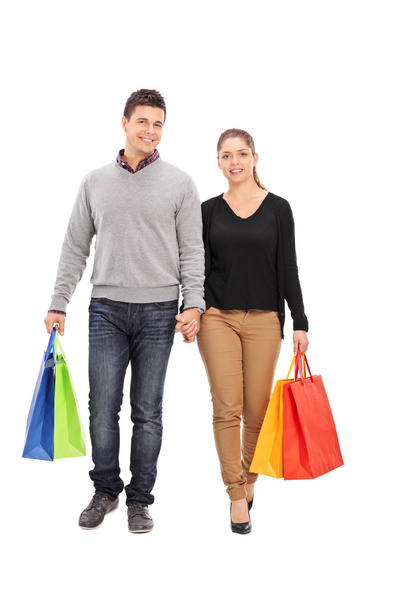 Couple walking with shopping bags - Photo, image