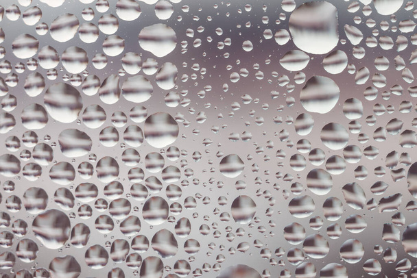 Water drops on window glass. Abstract background.The small depth of field. - Photo, Image