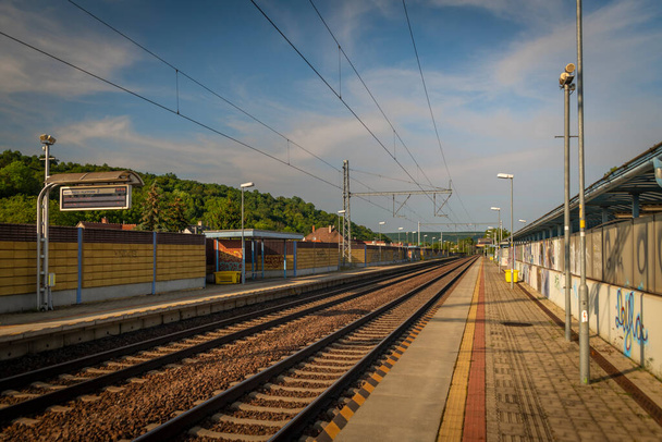 Main railway near Trencin town in west Slovakia in late afternoon in hot summer - Photo, Image