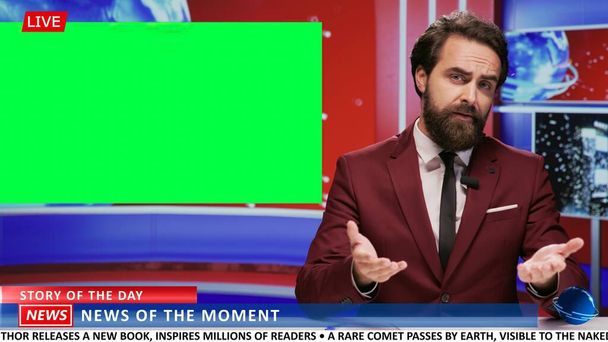 Journalist covers news on greenscreen in newsroom, addressing latest events and presenting daily information live on tv program. Newscaster using isolated copyspace template in studio. - Photo, Image