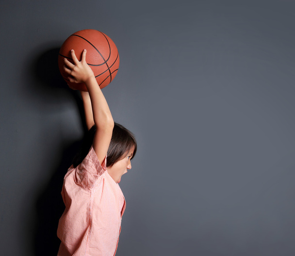 little boy holding a basketball - 写真・画像
