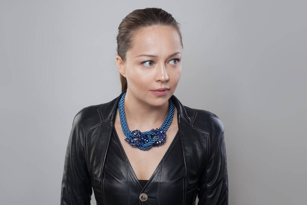 Perfect blue necklace on neck of brunette model woman - Photo, Image