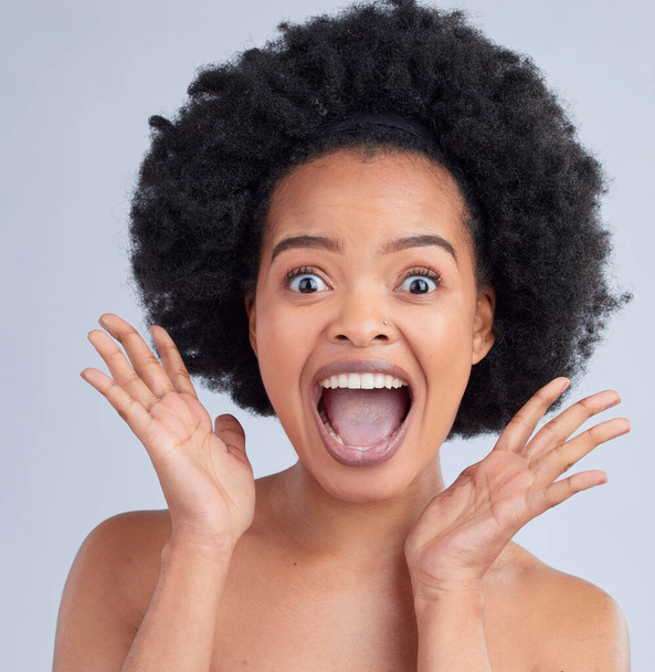 Surprise, skincare and portrait of woman in a studio for cosmetic, glamour and face routine. Shock, happy and African female model with hair treatment for afro and makeup isolated by white background. - Φωτογραφία, εικόνα
