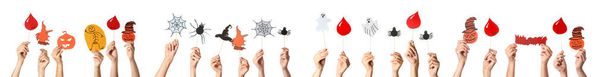 Many hands with Halloween decor on white background - 写真・画像