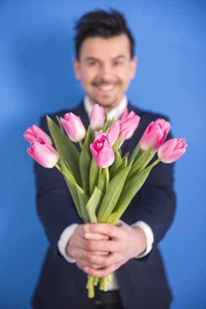 Man with flowers - Zdjęcie, obraz