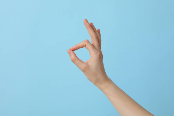 Female hand shows OK gesture. OK hand sign - Photo, Image