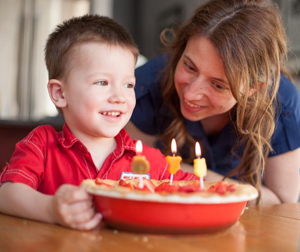 Boy celebrating his birthday with his mother - Photo, Image