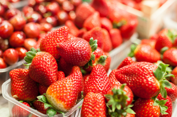 Strawberries for sale at market stall - Fotó, kép