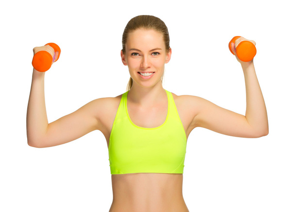 Young sporty girl with dumbbells - Foto, imagen